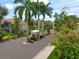 Gated entrance to community with palm trees at 4215 Breezeway Blvd # 2420, Sarasota, FL 34238