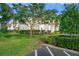 Condo building exterior with landscaping at 4215 Breezeway Blvd # 2420, Sarasota, FL 34238