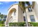 Two-story condo building with blue door and stairs at 4215 Breezeway Blvd # 2420, Sarasota, FL 34238