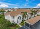 Condo building with carport and landscaping at 4215 Breezeway Blvd # 2420, Sarasota, FL 34238