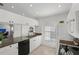 Modern kitchen with white cabinets and granite counters at 4215 Breezeway Blvd # 2420, Sarasota, FL 34238