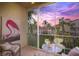 Relaxing lanai with wicker chair and view at 4215 Breezeway Blvd # 2420, Sarasota, FL 34238