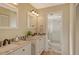 Bathroom with double vanity, granite countertop, and a walk-in shower at 4302 Madeira Ct # 3334, Sarasota, FL 34233