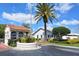 Community entrance with guardhouse and lush landscaping at 4302 Madeira Ct # 3334, Sarasota, FL 34233