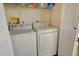 Small laundry room with washer and dryer, and shelving at 4302 Madeira Ct # 3334, Sarasota, FL 34233