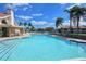 Relaxing community pool with patio furniture and nearby clubhouse at 4302 Madeira Ct # 3334, Sarasota, FL 34233