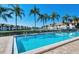 Inviting community pool surrounded by lush tropical landscaping at 4302 Madeira Ct # 3334, Sarasota, FL 34233