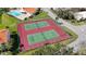 Two well-maintained tennis courts with aerial view at 4302 Madeira Ct # 3334, Sarasota, FL 34233