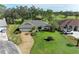 Single-story home with a gray roof and nicely landscaped yard at 4364 Brandywine Dr, Sarasota, FL 34241