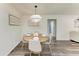 Bright dining room with wood table and four chairs at 4364 Brandywine Dr, Sarasota, FL 34241