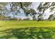 Serene golf course view from a backyard patio at 4364 Brandywine Dr, Sarasota, FL 34241