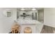 Kitchen island with seating and white shaker cabinets at 4364 Brandywine Dr, Sarasota, FL 34241