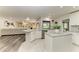 Modern kitchen with white cabinets, granite countertops, and an island at 4364 Brandywine Dr, Sarasota, FL 34241