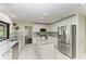 Updated kitchen featuring stainless steel appliances and white cabinetry at 4364 Brandywine Dr, Sarasota, FL 34241