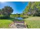 Ornamental pond with a bench, offering a peaceful view at 4364 Brandywine Dr, Sarasota, FL 34241