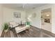 Bright sitting area with wood-look floors and access to the kitchen at 4364 Brandywine Dr, Sarasota, FL 34241