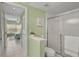 Bright bathroom features a shower with glass door and tile floors at 4705 Sand Trap Street E Cir # 105, Bradenton, FL 34203