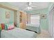 Charming bedroom featuring twin beds, built-in storage, and a bright, cheerful decor at 4705 Sand Trap Street E Cir # 105, Bradenton, FL 34203