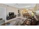 View of living room featuring a television, couch and an open floor plan at 4705 Sand Trap Street E Cir # 105, Bradenton, FL 34203