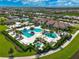 Aerial view of community amenities including pools and tennis courts at 4940 Surfside Cir, Bradenton, FL 34211