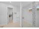 Spa-like bathroom with walk-in shower, gray tile accents, and bench at 4940 Surfside Cir, Bradenton, FL 34211