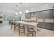 Modern kitchen with gray cabinets and a large island at 4940 Surfside Cir, Bradenton, FL 34211