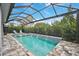 Relaxing pool area with covered patio and lush landscaping at 4940 Surfside Cir, Bradenton, FL 34211