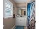 Bathroom with white vanity and blue shower curtain at 5424 81St Avenue E Cir, Palmetto, FL 34221