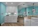 White shaker cabinets, quartz countertops, and mosaic backsplash in this kitchen at 5424 81St Avenue E Cir, Palmetto, FL 34221