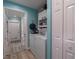 Bright laundry room with washer, dryer, and storage at 5424 81St Avenue E Cir, Palmetto, FL 34221