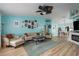 Open-concept living area with hardwood floors, a neutral color palette, and a fireplace at 5424 81St Avenue E Cir, Palmetto, FL 34221