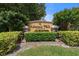 Elegant 'Admirals Walk' community sign surrounded by lush greenery and well-maintained landscaping at 5711 Soldier Cir # 204, Sarasota, FL 34233