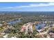 Beautiful aerial view of the Longwood Park neighborhood featuring houses, green spaces, and serene lakes at 5827 Beaurivage Ave, Sarasota, FL 34243