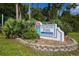 A welcoming Longwood Park sign surrounded by lush landscaping, creating a great first impression of the community at 5827 Beaurivage Ave, Sarasota, FL 34243