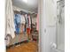 Well-organized closet and adjacent bathroom with shower at 6084 Red Maple Rd, Bradenton, FL 34210