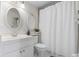 Clean bathroom with white vanity, oval mirrors, and shower/tub combo at 6084 Red Maple Rd, Bradenton, FL 34210