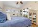 Bright bedroom with king bed, balcony access, and ample closet space at 6084 Red Maple Rd, Bradenton, FL 34210