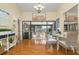 Bright dining area with hardwood floors and access to a screened balcony at 6084 Red Maple Rd, Bradenton, FL 34210