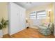 Bright guest room with a built-in murphy bed and comfortable seating at 6084 Red Maple Rd, Bradenton, FL 34210