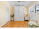 Guest room featuring a wall bed, hardwood floors, and plenty of light at 6084 Red Maple Rd, Bradenton, FL 34210