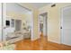 Bright hallway with hardwood floors, and views into living areas at 6084 Red Maple Rd, Bradenton, FL 34210