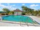 Inviting community pool with surrounding lounge chairs at 6084 Red Maple Rd, Bradenton, FL 34210