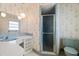 Retro bathroom with blue tile, shower, and vanity at 617 Whitfield Ave, Sarasota, FL 34243