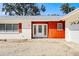 House entrance with double doors and orange siding at 617 Whitfield Ave, Sarasota, FL 34243