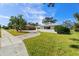 White house with palm trees and a curved driveway at 617 Whitfield Ave, Sarasota, FL 34243