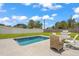 Spacious backyard oasis with a refreshing pool and patio furniture at 6228 Fordham Pl, Bradenton, FL 34207