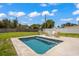 Private backyard with inviting pool and patio seating at 6228 Fordham Pl, Bradenton, FL 34207