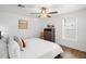 Bedroom with queen bed and dresser, hardwood floors and ceiling fan at 6228 Fordham Pl, Bradenton, FL 34207