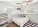 Well-lit bedroom featuring a bunk bed and built-in shelving at 6228 Fordham Pl, Bradenton, FL 34207