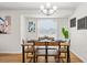 Charming dining room with wood table and hardwood floors at 6228 Fordham Pl, Bradenton, FL 34207